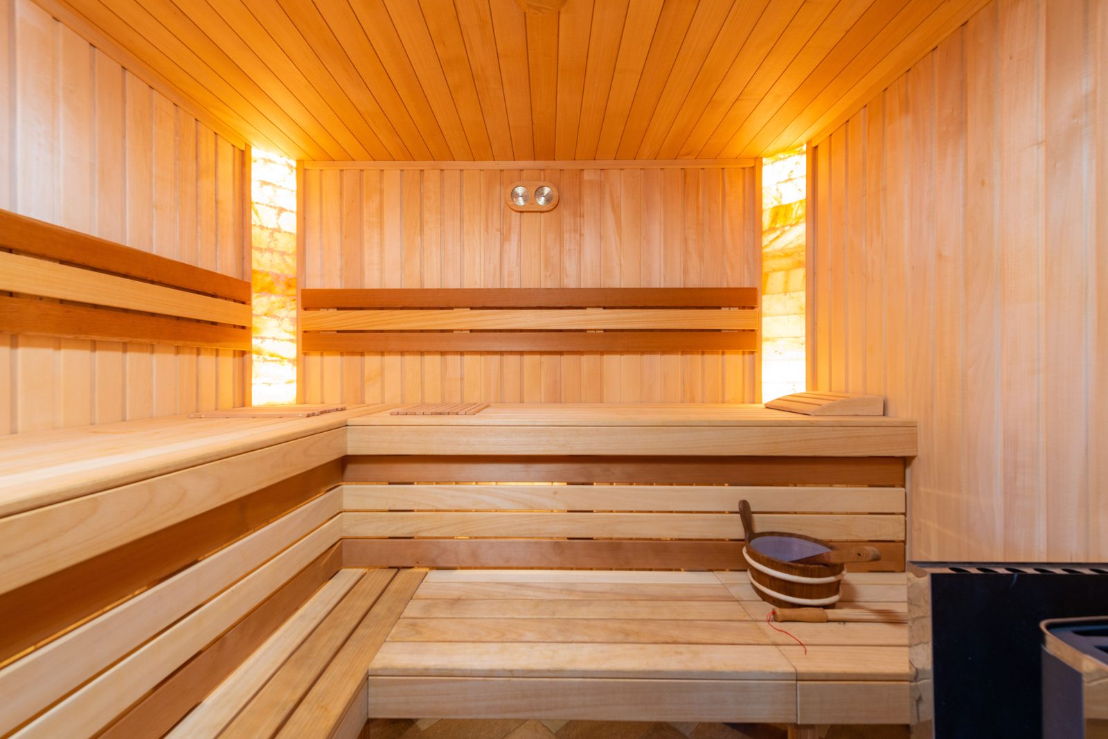 The still heat of a wooden sauna.